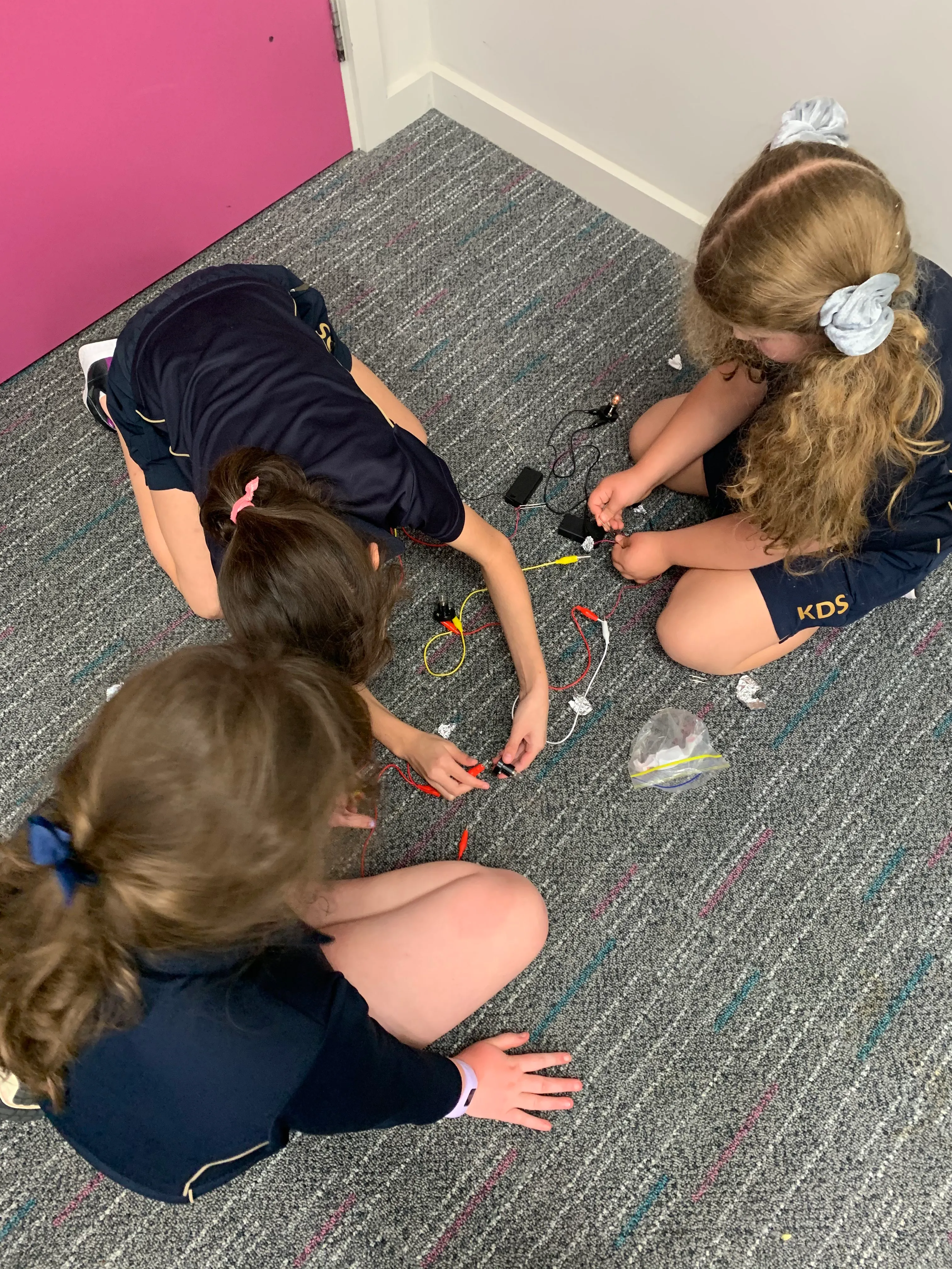 children experimenting with circuitry