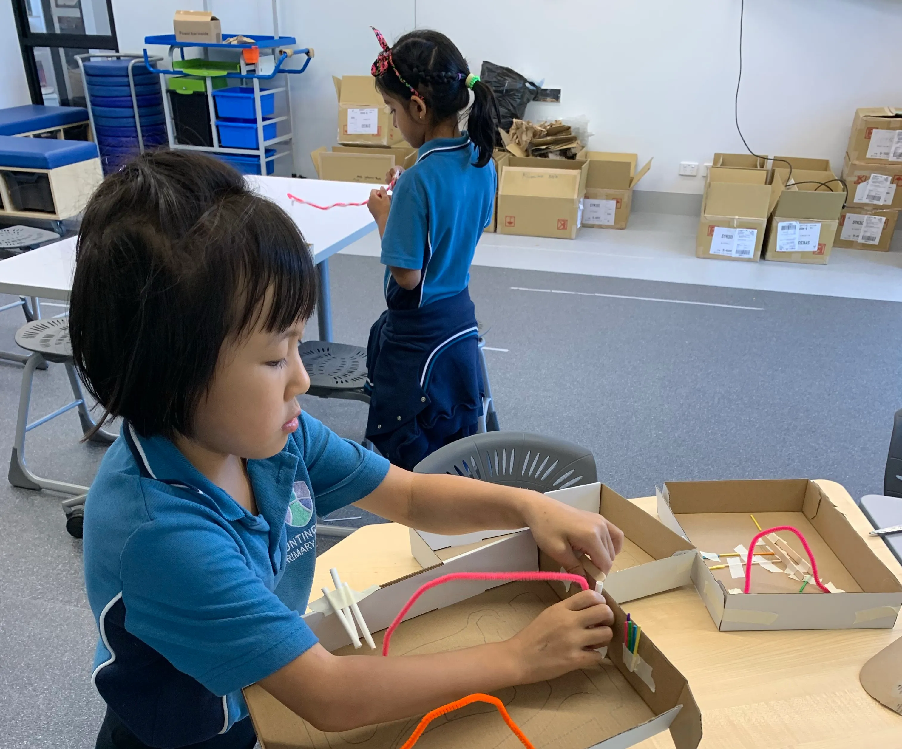 child creating an electricity box