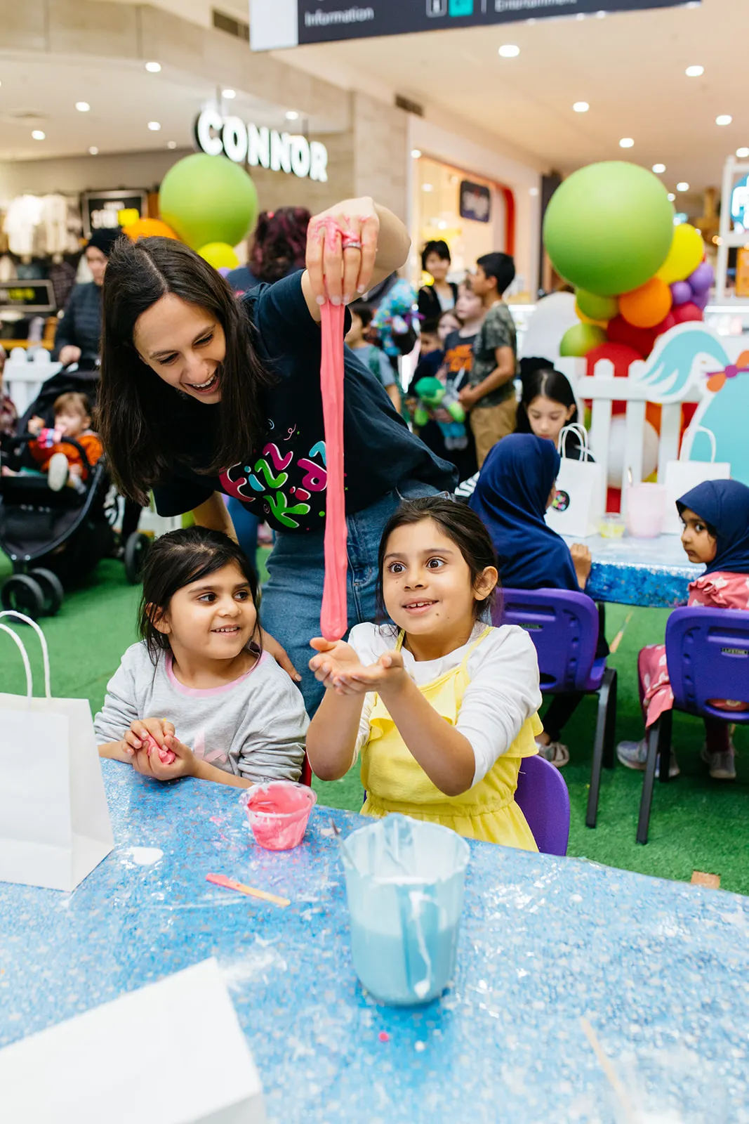 A child playing with slime they made