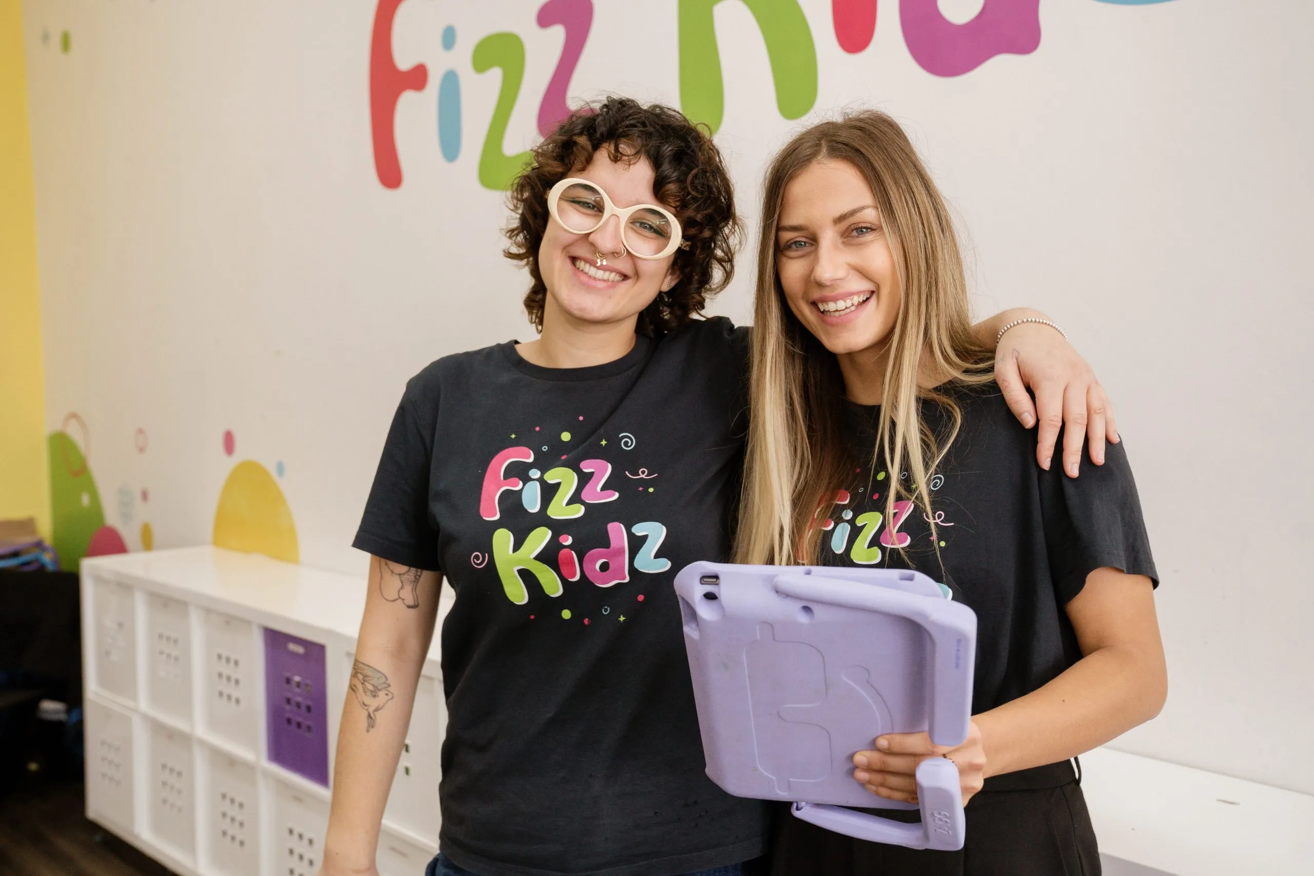 A Fizz Kids staff holding an experiment